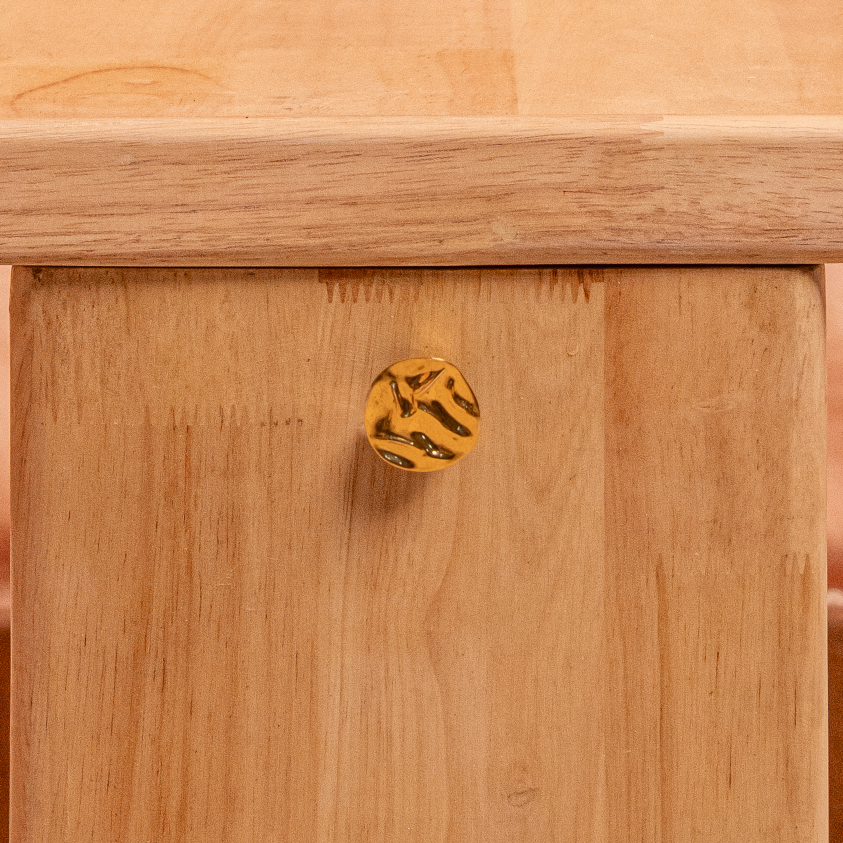 Wooden table with a unique base design on a textured surface